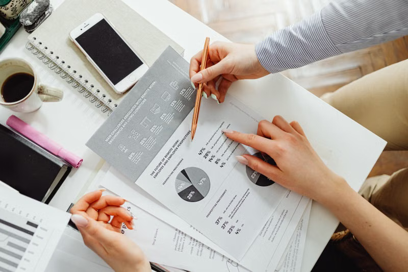 Wealth advisor discussing portfolio strategy with clients